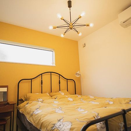 Orange County Guest House Izumisano Ruang foto